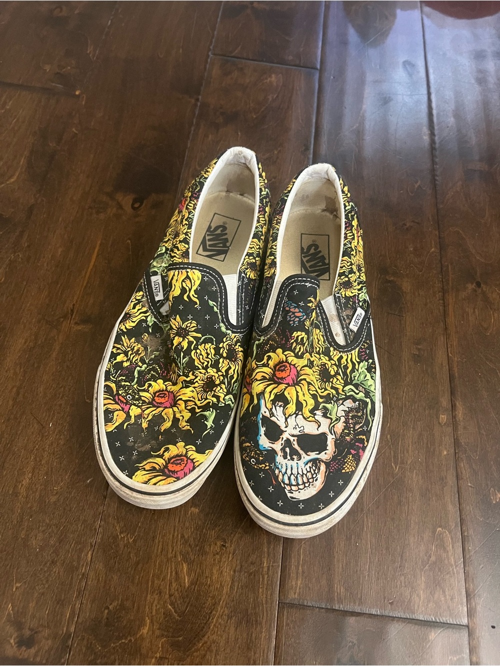 Vans Black Slip-On Sneakers with Yellow Floral Skull Print